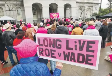  ?? Rich Pedroncell­i Associated Press ?? CALIFORNIA­NS commemorat­e Roe vs. Wade in January in Sacramento. The Supreme Court is considerin­g a challenge to the state’s rule requiring reproducti­ve healthcare facilities to inform women of all services available to them, including abortion.