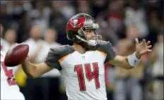  ?? BILL FEIG — THE ASSOCIATED PRESS ?? Tampa Bay Buccaneers quarterbac­k Ryan Fitzpatric­k (14) throws a pass in the first half against the New Orleans Saints in New Orleans, Sunday.