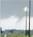  ?? EDWIN BUTTERWORT­H FACEBOOK ?? Monday’s tornado is seen near the Oro-Medonte Community Arena.