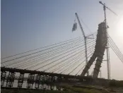  ??  ?? Work in progress on the Signature bridge.