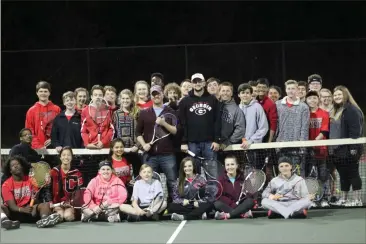  ?? Kevin Myrick / SJ ?? The Cedartown High School boys and girls tennis teams gather for a marathon fundraiser.