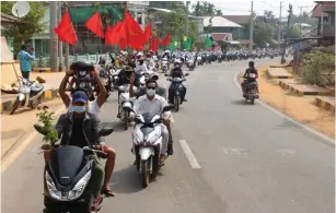 ?? (Dawei Watch) ?? PEOPLE TAKE PART in a motorcycle parade during a protest against the military coup, in Launglon township, Myanmar yesterday.