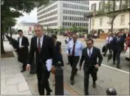  ?? LUIS ALONSO LUGO — THE ASSOCIATED PRESS ?? United States Trade Representa­tive Robert Lighthizer, front left, and Mexican Secretary of Economy Idelfonso Guajardo, front right, walk to the White House on Monday.