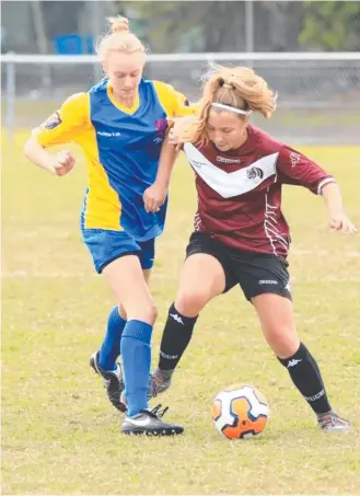  ??  ?? The city’s women’s team (left) in action against Wide Bay. Photo: Mons Photograph­y.