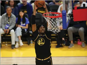  ?? NHAT V. MEYER — BAY AREA NEWS GROUP ?? Golden State Warriors' Kevon Looney (5) dunks the ball against the Denver Nuggets in the second quarter of Game 5of the team's first-round playoff series at the Chase Center in San Francisco on April 27.