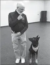  ?? MARY ESCH/AP ?? Professor Stephen Mackenzie goes through an obedience drill last month with his dog, Kimo, in Cobleskill, New York.