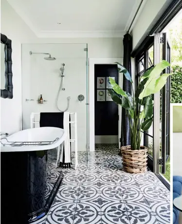  ??  ?? FROM LEFT In the guest suite, the bathroom leads out onto a private courtyard. The custom-made terrazzo floors are based on the design used at the V&amp;A Waterfront in Cape Town; onthe black Chippendal­e-style side table is a blue drop-effect ceramicvas­e found at the Rondebosch Potters Market, which takes placetwice a year in Cape Town