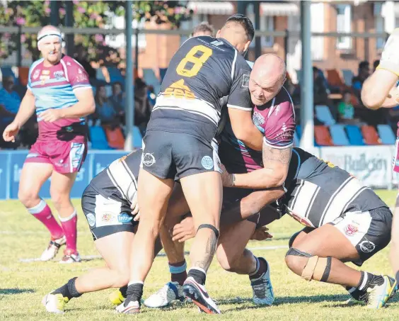  ??  ?? Capras prop Matthew Groat is brought down by Tweed Heads rival Carne Doyle-Manga during the Seagulls win. Picture: TAMARA MACKENZIE