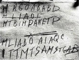  ??  ?? TOP: The scrap of paper torn from a rare edition of The Rubáiyát of Omar Khayyám and bearing the words “Tamám Shud”. ABOVE: Writing found in the back of a copy of the Rubáiyát matching the torn fragment.