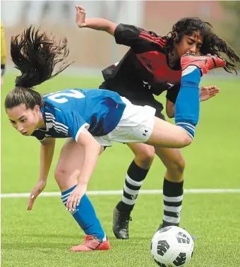  ?? ?? Grand River Renegades forward Tayler Schade, left, battles for a ball Thursday at midfield with Glenview Park Panthers defender Anouck Pardo in the WCSSAA girls’ soccer final at Schlegel Park in Kitchener. The Renegades prevailed, 6-2.