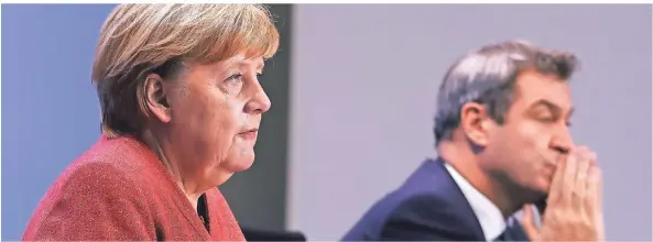  ?? FOTO: ODD ANDERSEN/AP ?? Bundeskanz­lerin Angela Merkel und Bayerns Ministerpr­äsident Markus Söder bei der Pressekonf­erenz am Montagaben­d in Berlin.