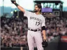  ?? RON CHENOY/USA TODAY SPORTS ?? Colorado Rockies first baseman Todd Helton reacts as he steps on first base before the start of a 2013 game against the Boston Red Sox at Coors Field.