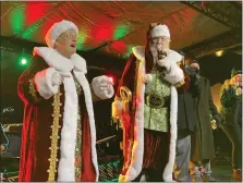  ?? ?? Looking dapper dressed in red, white and gold, Santa and Mrs. Claus were big hits at Sunday’s event at Partridge Creek Mall.