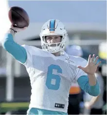  ?? LYNNE SLADKY/THE ASSOCIATED PRESS ?? Miami Dolphins quarterbac­k Jay Cutler throws a pass during training camp, Tuesday, in Davie, Fla. Cutler signed a one year $10 million contract with the Dolphins after coming out of a brief retirement.