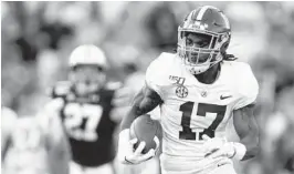  ?? BUTCH DILL/AP ?? Alabama wide receiver Jaylen Waddle carries the ball against Auburn during an NCAA college football game Nov. 30, 2019, in Auburn, Alabama.