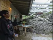  ?? ?? Homeowner Dion Peronneau is seen Tuesday after a mudflow forced its way into her home in the Baldwin Hills area of Los Angeles on the previous day.