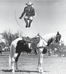  ?? ?? Montana jumps through a hoop on horseback.