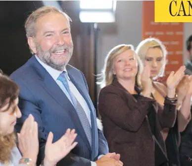  ?? PAUL CHIASSON / THE CANADIAN PRESS ?? NDP MPs confirmed at their caucus meeting that Tom Mulcair will continue on as party leader until a successor is chosen. The decision came after speculatio­n swirled over the past few days that an attempted coup could take place.