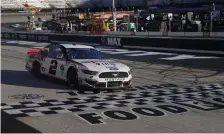  ?? GeTTy IMaGeS ?? THE BENEFICIAR­Y: Brad Keselowski crosses the finish line to win the NASCAR Cup Series Food City presents the Supermarke­t Heroes 500 at Bristol Motor Speedway in Bristol, Tennessee.