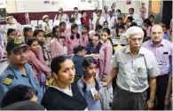  ?? - PTI ?? CONTAINER DEPOT: School students being treated at a hospital in New Delhi on Saturday after they complained of irritation in eyes due to gas leakage from a container depot near their school in southeast Delhi’s Tughlakaba­d area.