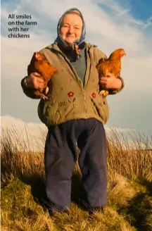  ?? ?? All smiles on the farm with her chickens