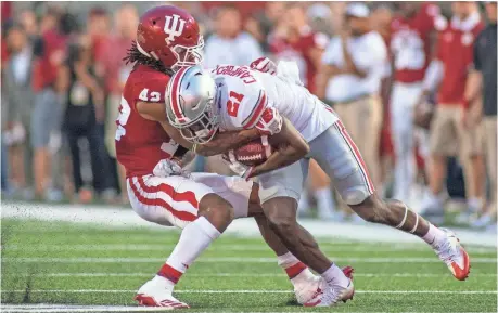  ?? TREVOR RUSZKOWSKI, USA TODAY SPORTS ?? Ohio State’s Parris Campbell lunges for yards Thursday against Indiana. Results of that game and more at ncaaf.usatoday.com.