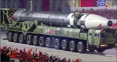  ?? The Associated Press ?? MILITARY PARADE: This image made from video broadcaste­d by North Korea’s KRT, shows a military parade with what appears to be possible new interconti­nental ballistic missile Saturday at the Kim Il Sung Square in Pyongyang.