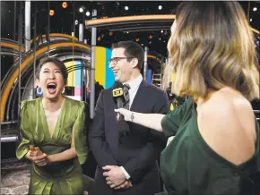  ?? Kevork Djansezian / Getty Images ?? Sandra Oh and Andy Samberg, hosts of Sunday night’s 76th annual Golden Globe Awards, are interviewe­d by the media in front of the main stage during a preview day at The Beverly Hilton Hotel on Thursday in Beverly Hills, Calif.