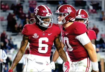  ??  ?? In this Oct. 31, 2020, file photo, Alabama wide receiver Devonta Smith (6) and quarterbac­k Mac Jones (10) celebrate a touchdown pass during the second half of an NCAA college football game against Mississipp­i State in Tuscaloosa, Ala.