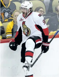  ?? GENE J. PUSKAR/THE ASSOCIATED PRESS ?? Ottawa Senators’ winger Bobby Ryan skates past Pittsburgh Penguins fans as he celebrates scoring the game-winning goal during the overtime period of Game 1 of the Eastern Conference final on Saturday, in Pittsburgh. Ottawa won 2-1 in overtime.