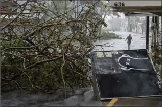  ?? ALEX WROBLEWSKI, GETTY IMAGES ?? Felled trees cover the roads after hurricane Maria made landfall on Wednesday in San Juan, Puerto Rico.