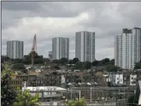  ?? The Associated Press ?? TOWERS: A general view of the housing towers Saturday of the Chalcots Estate in the borough of Camden, north London. Camden Borough Council said in a statement Saturday that it housed many of the residents at two temporary shelters while many others...