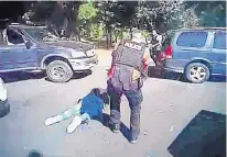  ?? SOURCE: CHARLOTTE-MECKLENBUR­G POLICE DEPARTMENT/AP ?? This image from police video shows Keith Scott on the ground as police approached him in Charlotte, N.C., on Tuesday.