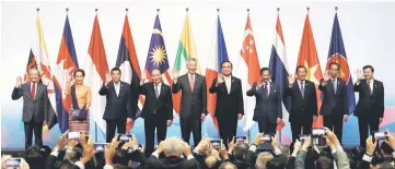  ?? — Reuters photo ?? Asean leaders gather for a group photo during the opening ceremony of the 33rd Asean Summit in Singapore.