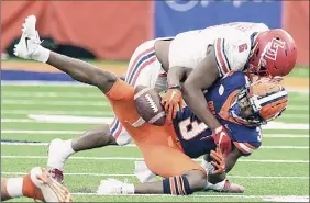  ?? Dennis Nett / Associated Press ?? Syracuse wide receiver Taj Harris drops a pass in the second half against Liberty. Harris caught nine passes for 96 yards and a touchdown.