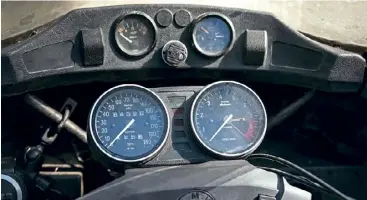  ??  ?? BELOW: Although the dash on the R100T is sparse by modern standards, it's equipped with everything you need, including (my personal favourite) an analogue clock; perfect for ensuring you make it to your next business meeting with time to spare.