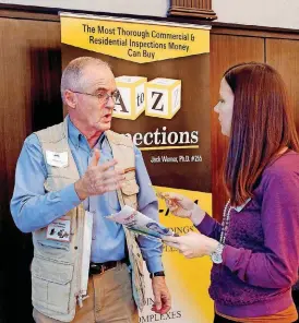  ??  ?? Jack Werner talks with Misty Clark, a student at Oklahoma City University, at the January 2016 Commercial Real Estate Summit in the Nigh Center at the University of Central Oklahoma in Edmond.