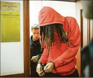  ?? Alexander Zemlianich­enko / Associated Press ?? WNBA star and two-time Olympic gold medalist Brittney Griner leaves a courtroom after a hearing in Khimki, just outside Moscow, on Friday.