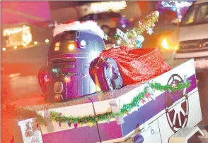  ??  ?? An R2 series droid rides in the trailer in a Project Fire Buddies convoy that visited nine homes.