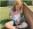  ?? (AP Photo/alina Hartounian) ?? Dotty the desert tortoise greets Seyda Robertson in Scottsdale, Ariz.