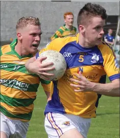  ??  ?? Darren Carty of Taghmon-Camross is chased by Leon Stafford.