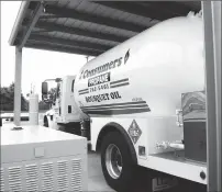  ?? Photo by Ernest A. Brown ?? A Consumers Propane truck, like the one that Gagnon typically drives, loads propane fuel at the River Street facility in Woonsocket Friday.
