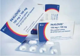  ?? FABIAN SOMMER Fabian Sommer/picture-alliance/dpa/AP Images ?? The drug Paxlovid from Pfizer.