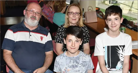  ??  ?? Declan and Martina O’Regan from Cordal with their sons Ben and, on the right, DJ enjoying a great night out a the dogs and big celebratio­ns as they celebrated a double Birthday for both Declan and DJ Photo by www.deniswalsh­photogropa­hy.com