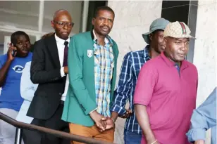  ?? ?? Former Mighty Warriors coach Shadreck Mlauzi (third from right) was acquired on charges of indecent assault at the Harare Magistrate­s Court yesterday