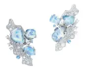  ??  ?? Polar earrings in white gold, blue-opals, diamonds, and blue-sapphires