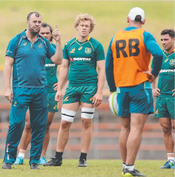  ?? Picture: GETTY IMAGES ?? Wallabies coach Michael Cheika talks to his troops at training ahead of their clash with the Barbarians.