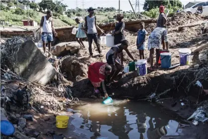  ?? Marco Longari/AFP/Getty Images ?? South Africans struggle to cope after freak rainfall near Durban earlier this month – one in a growing toll of global disasters. Photograph: