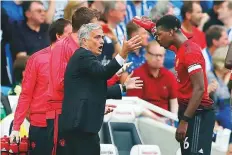  ?? AP ?? Manchester United’s manager Jose Mourinho gestures as he speaks to Paul Pogba during the match against Brighton.