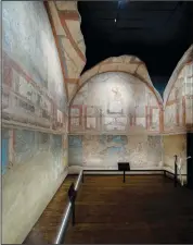  ?? ?? The frescoes coming from the sacellum, a small votive chapel, of a two-story home are on display at the Caracalla archaeolog­ical park.